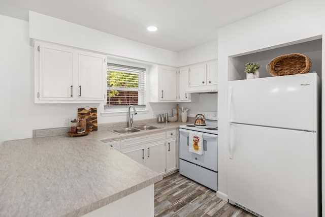 306 Forrest Pkwy, Crestview, FL 32539 - kitchen with white appliances, a sink, under cabinet range hood, white cabinetry, and recessed lighting