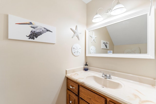 21514 Front Beach Rd, Panama City Beach, FL 32413 - bathroom featuring vanity and vaulted ceiling