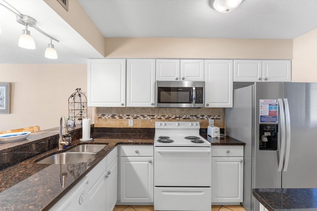 21514 Front Beach Rd, Panama City Beach, FL 32413 - kitchen featuring stainless steel appliances, backsplash, and white cabinets