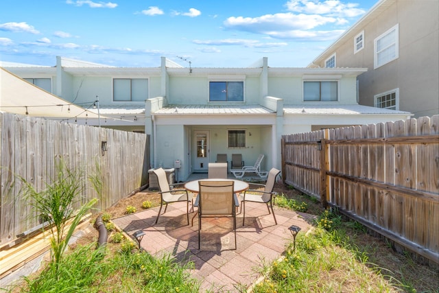21514 Front Beach Rd, Panama City Beach, FL 32413 - fenced backyard featuring a patio area and outdoor dining area