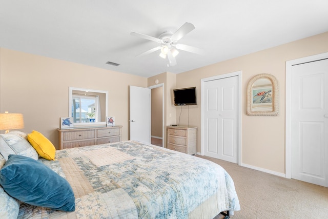 21514 Front Beach Rd, Panama City Beach, FL 32413 - bedroom with light carpet, ceiling fan, and two closets