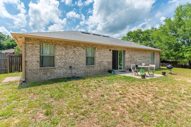 6229 Flash Ln, Crestview, FL 32536 - rear view of property with brick siding, a patio, and a shingled roof