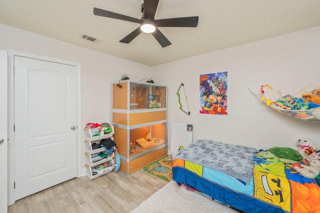 6229 Flash Ln, Crestview, FL 32536 - bedroom with wood finished floors and a ceiling fan
