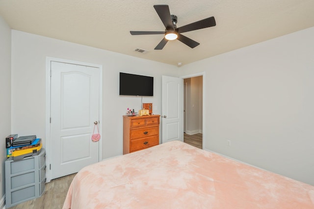 6229 Flash Ln, Crestview, FL 32536 - bedroom featuring light wood-style floors, a ceiling fan, and baseboards