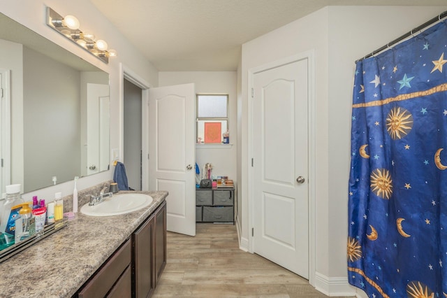 6229 Flash Ln, Crestview, FL 32536 - bathroom featuring wood finished floors, vanity, and a shower with curtain