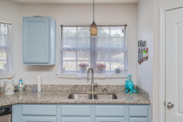 6229 Flash Ln, Crestview, FL 32536 - kitchen featuring a sink, stainless steel dishwasher, blue cabinetry, light stone countertops, and pendant lighting