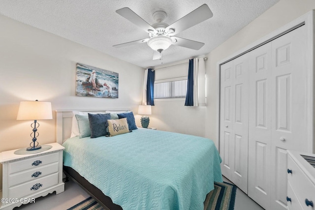 17155 Front Beach Rd Unit W405, Panama City Beach, FL 32413 - bedroom with a closet, a textured ceiling, and a ceiling fan