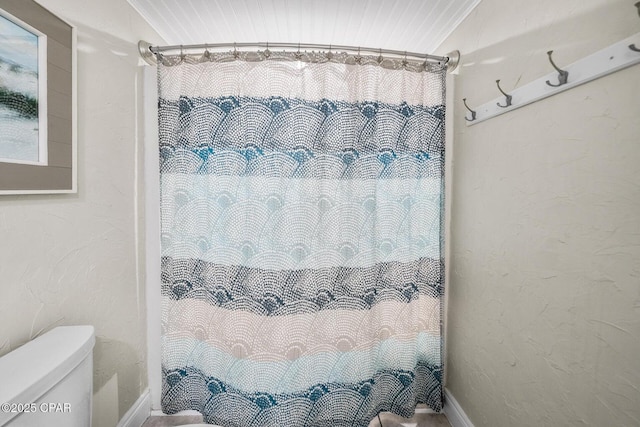 17155 Front Beach Rd Unit W405, Panama City Beach, FL 32413 - bathroom featuring toilet, a shower with shower curtain, and baseboards