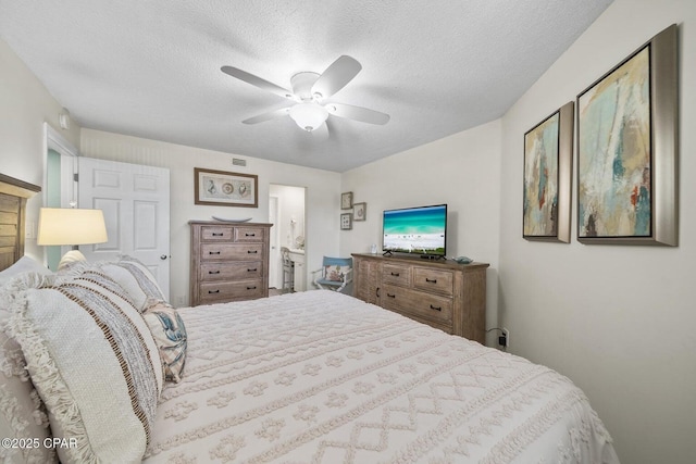17155 Front Beach Rd Unit W405, Panama City Beach, FL 32413 - bedroom featuring a textured ceiling, ceiling fan, and ensuite bath