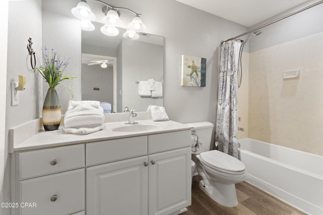 16819 Front Beach Rd Unit 1501, Panama City Beach, FL 32413 - full bath featuring toilet, vanity, wood finished floors, shower / bathtub combination with curtain, and ceiling fan