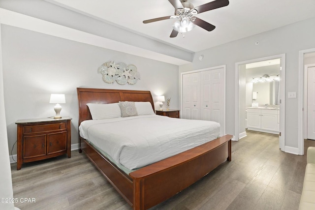 16819 Front Beach Rd Unit 1501, Panama City Beach, FL 32413 - bedroom featuring light wood-style floors, a closet, baseboards, ensuite bathroom, and ceiling fan