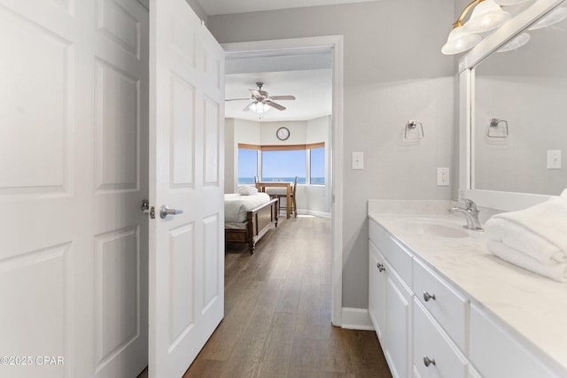 16819 Front Beach Rd Unit 1501, Panama City Beach, FL 32413 - bathroom with vanity, ceiling fan, wood finished floors, and baseboards