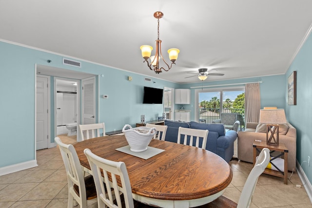 502 Gulf Shore Dr Unit 215, Destin, FL 32541 - dining area featuring light tile patterned floors, a chandelier, ornamental molding, a ceiling fan, and baseboards