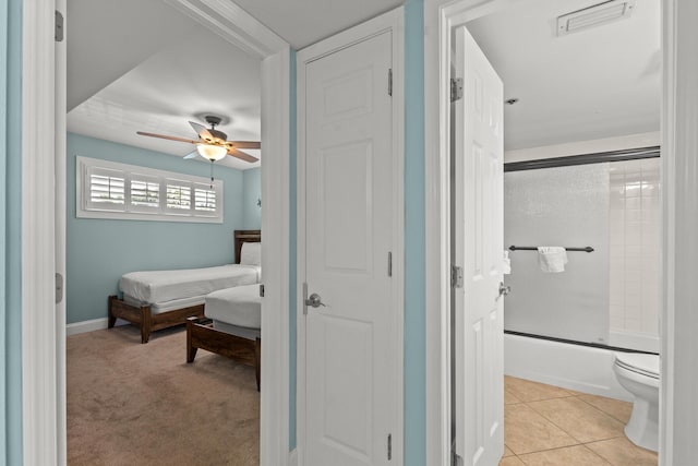 502 Gulf Shore Dr Unit 215, Destin, FL 32541 - ensuite bathroom featuring combined bath / shower with glass door, toilet, and a ceiling fan