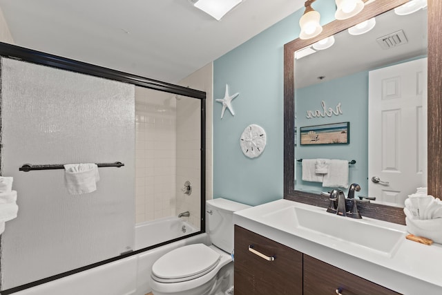 502 Gulf Shore Dr Unit 215, Destin, FL 32541 - full bath with toilet, vanity, and bath / shower combo with glass door