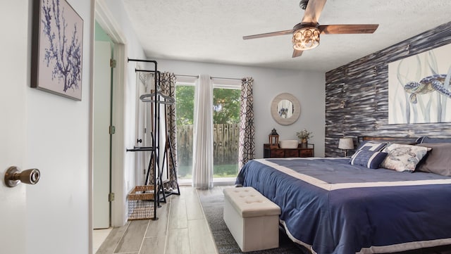 17642 Front Beach Rd Unit G4, Panama City Beach, FL 32413 - bedroom featuring a textured ceiling, access to outside, and ceiling fan