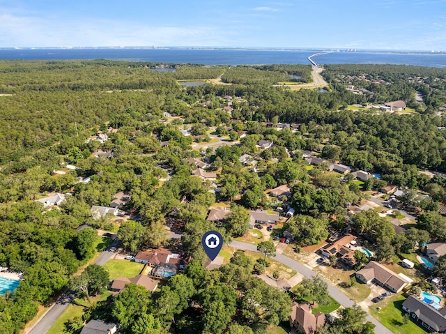 207 Oakwood Cir, Niceville, FL 32578 - aerial view of property's location with a heavily wooded area, a large body of water, and nearby suburban area