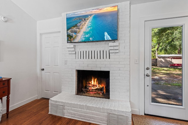 207 Oakwood Cir, Niceville, FL 32578 - detailed view of wood finished floors, a fireplace, and baseboards