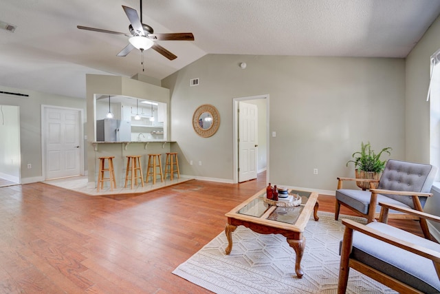 4236 Edge Perry Rd, Crestview, FL 32539 - living area featuring a ceiling fan, light wood-type flooring, lofted ceiling, and baseboards