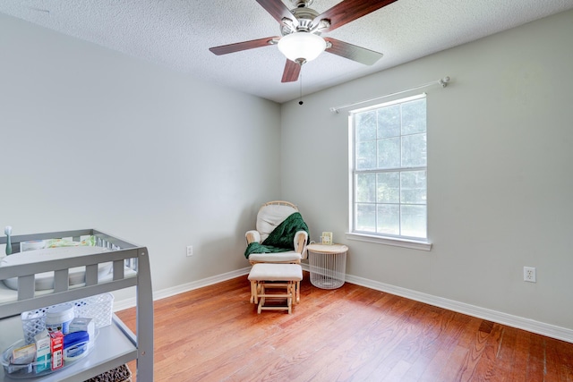 4236 Edge Perry Rd, Crestview, FL 32539 - bedroom with wood finished floors, baseboards, a textured ceiling, and a ceiling fan