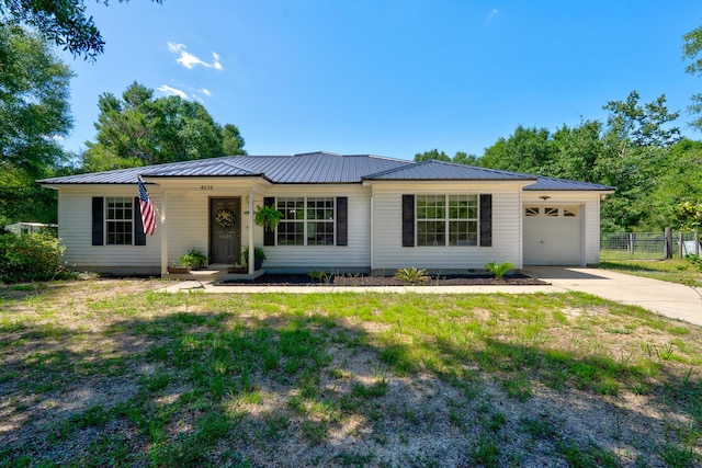 4236 Edge Perry Rd, Crestview, FL 32539 - ranch-style house with concrete driveway, metal roof, and an attached garage