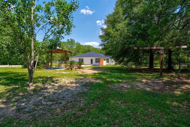 4236 Edge Perry Rd, Crestview, FL 32539 - view of grassy yard featuring a detached carport