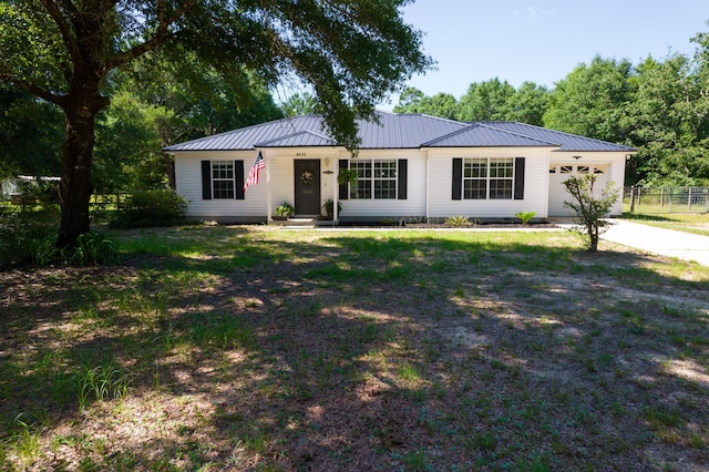 4236 Edge Perry Rd, Crestview, FL 32539 - single story home featuring a garage, metal roof, and concrete driveway