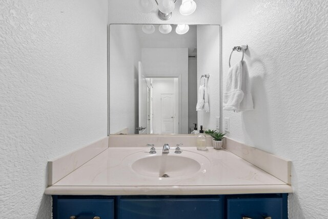 142 Southfields Rd, Panama City Beach, FL 32413 - bathroom with a textured wall and vanity