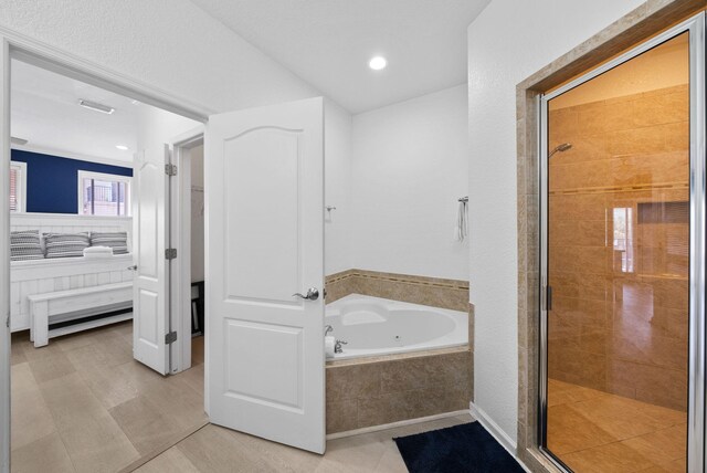142 Southfields Rd, Panama City Beach, FL 32413 - full bathroom featuring a whirlpool tub, a shower stall, connected bathroom, tile patterned flooring, and recessed lighting