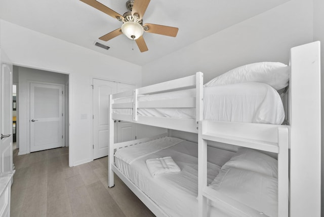 142 Southfields Rd, Panama City Beach, FL 32413 - bedroom featuring wood finished floors and ceiling fan