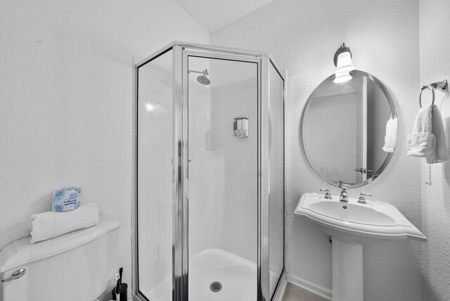 142 Southfields Rd, Panama City Beach, FL 32413 - full bathroom with a stall shower, toilet, and a textured wall