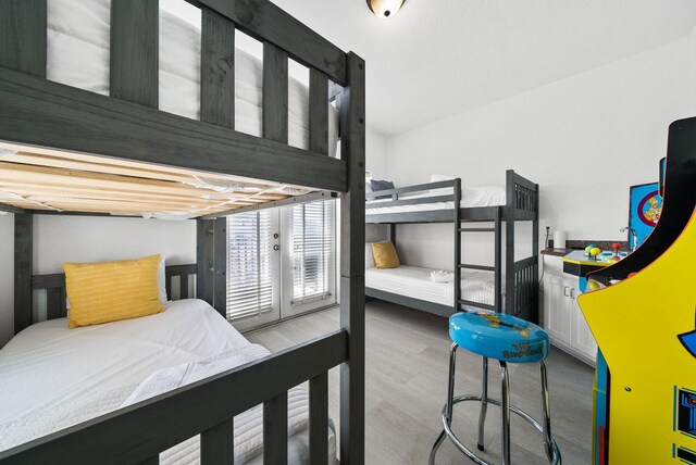 142 Southfields Rd, Panama City Beach, FL 32413 - bedroom with wood finished floors and access to exterior
