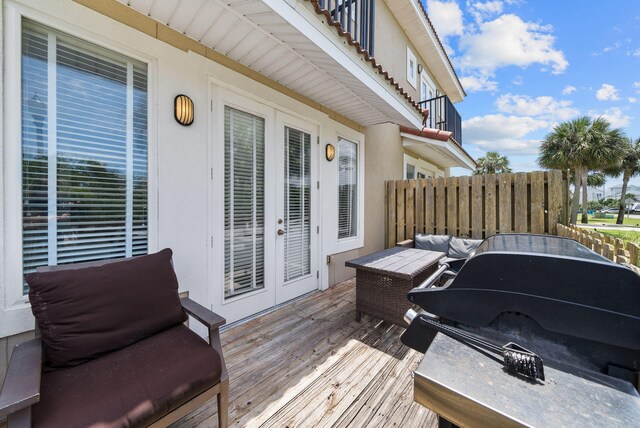142 Southfields Rd, Panama City Beach, FL 32413 - wooden deck with french doors and an outdoor living space