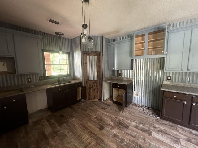 4932 Joiner Cir, Milton, FL 32583 - kitchen featuring a sink, dark wood-style floors, open shelves, a textured ceiling, and pendant lighting