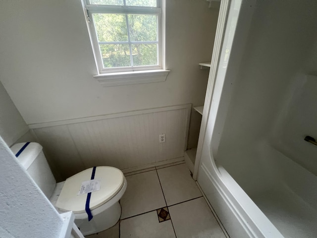 4932 Joiner Cir, Milton, FL 32583 - bathroom with toilet, tile patterned floors, and a wainscoted wall