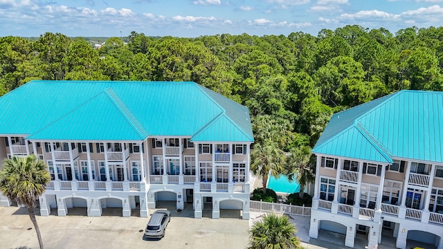 512 Dement Cir Apt F, Panama City Beach, FL 32407 - bird's eye view of a pool and a forest