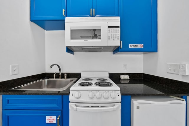 512 Dement Cir Apt F, Panama City Beach, FL 32407 - kitchen with white appliances, blue cabinets, and a sink
