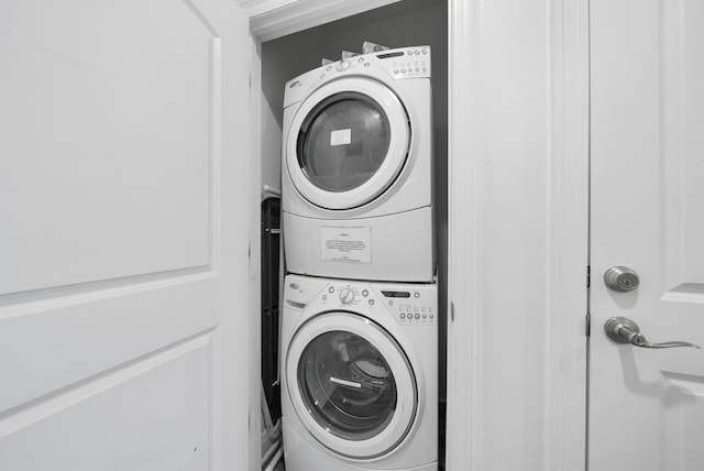 512 Dement Cir Apt F, Panama City Beach, FL 32407 - washroom with stacked washing machine and dryer