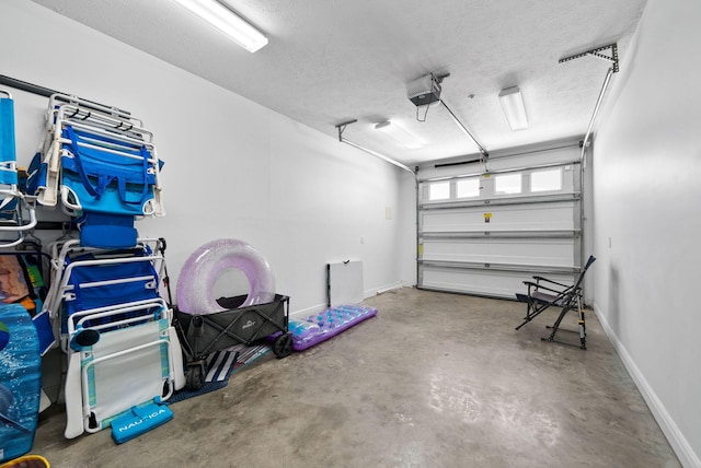 512 Dement Cir Apt F, Panama City Beach, FL 32407 - garage featuring baseboards and a garage door opener