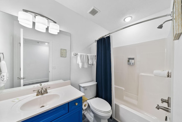 512 Dement Cir Apt F, Panama City Beach, FL 32407 - full bath featuring toilet, vanity, shower / tub combo, and a textured ceiling