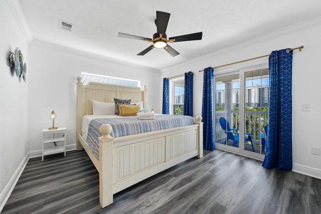 512 Dement Cir Apt F, Panama City Beach, FL 32407 - bedroom with access to exterior, dark wood finished floors, baseboards, multiple windows, and crown molding