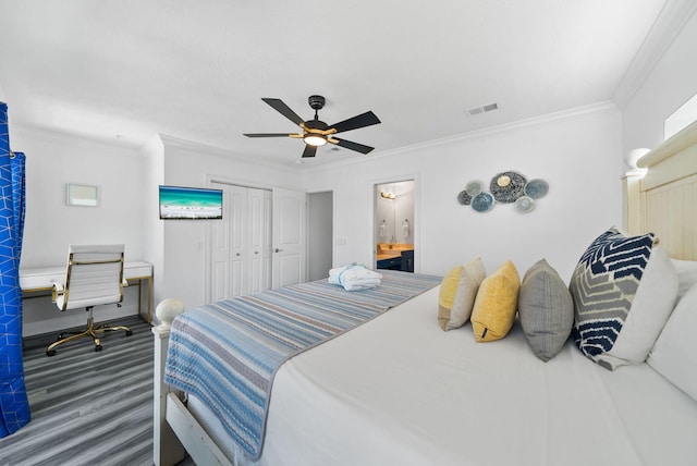 512 Dement Cir Apt F, Panama City Beach, FL 32407 - bedroom featuring ornamental molding, baseboards, wood finished floors, a ceiling fan, and a closet