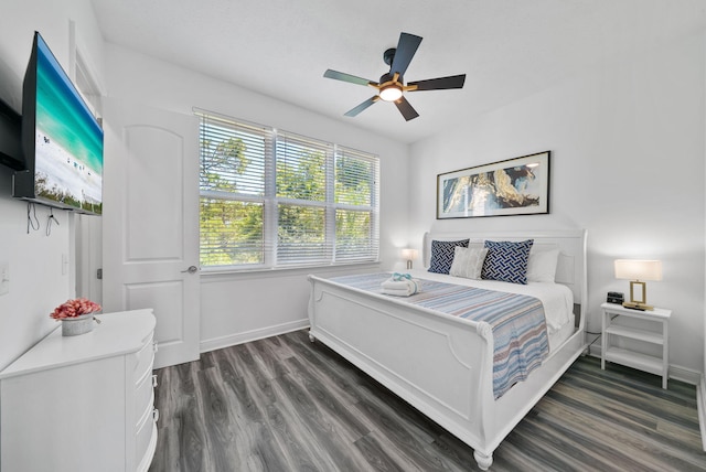 512 Dement Cir Apt F, Panama City Beach, FL 32407 - bedroom featuring dark wood-type flooring, baseboards, and a ceiling fan