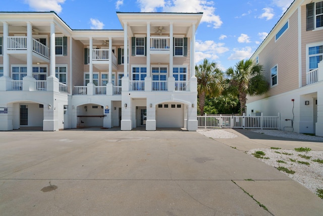 512 Dement Cir Apt F, Panama City Beach, FL 32407 - view of property with a garage and concrete driveway