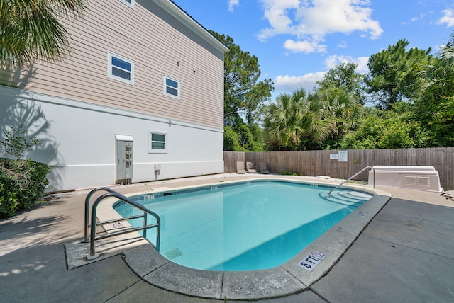 512 Dement Cir Apt F, Panama City Beach, FL 32407 - community pool featuring a fenced backyard and a patio