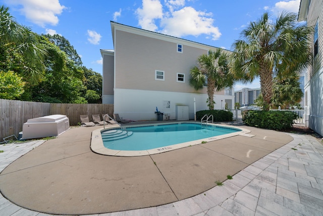 512 Dement Cir Apt F, Panama City Beach, FL 32407 - community pool featuring a patio area