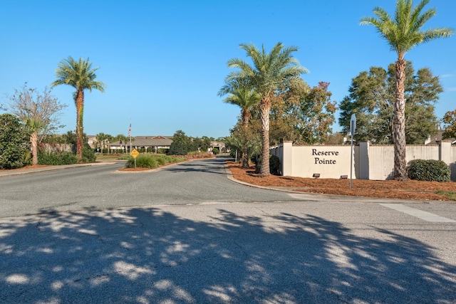 2065 Wilsons Plover Cir, Navarre, FL 32566 - view of asphalt street featuring traffic signs and curbs