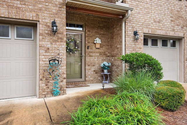 2065 Wilsons Plover Cir, Navarre, FL 32566 - property entrance featuring brick siding and an attached garage