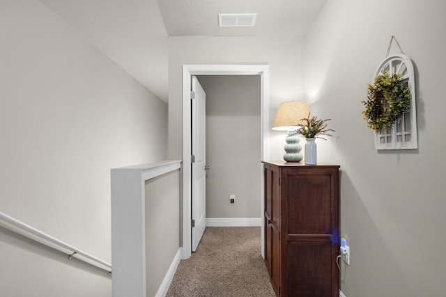 2065 Wilsons Plover Cir, Navarre, FL 32566 - hallway with light colored carpet, baseboards, and an upstairs landing