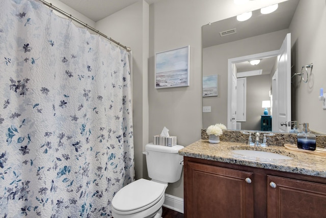 2065 Wilsons Plover Cir, Navarre, FL 32566 - bathroom featuring vanity, toilet, and a shower with shower curtain